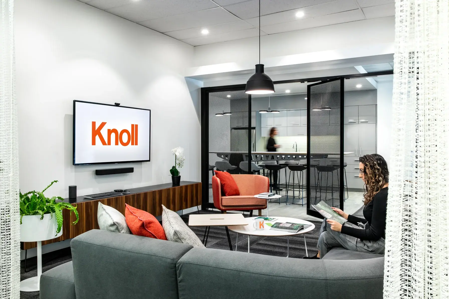 People using a workplace lounge and collaboration area
