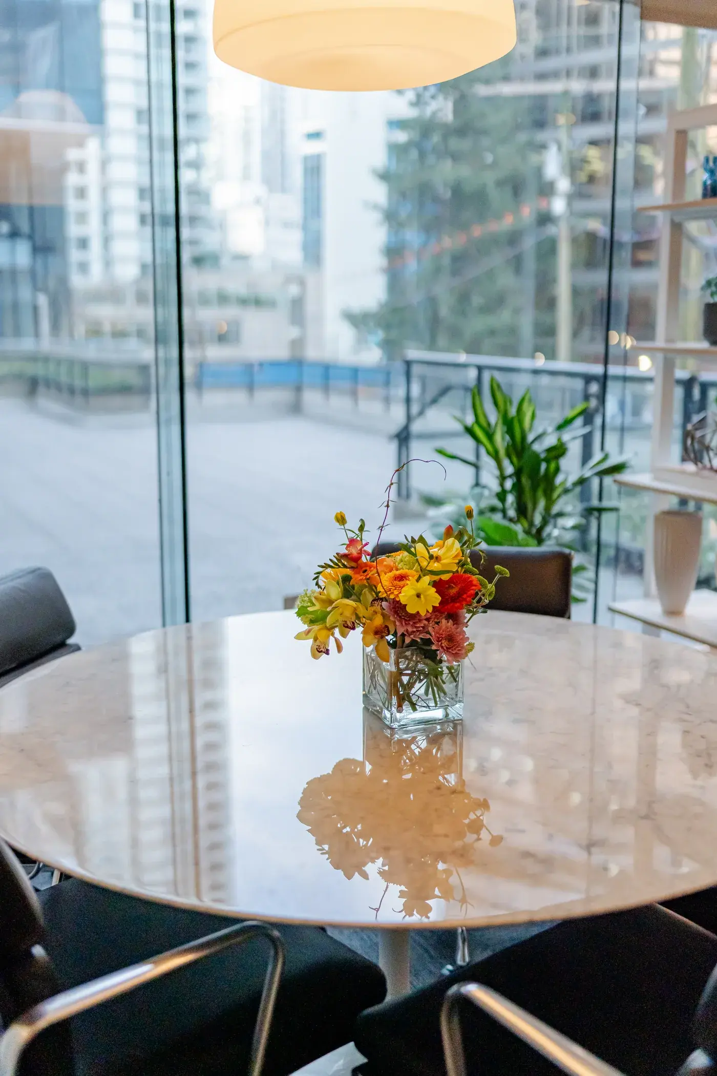 A flower arrangement on a meeting table in the refreshed showroom