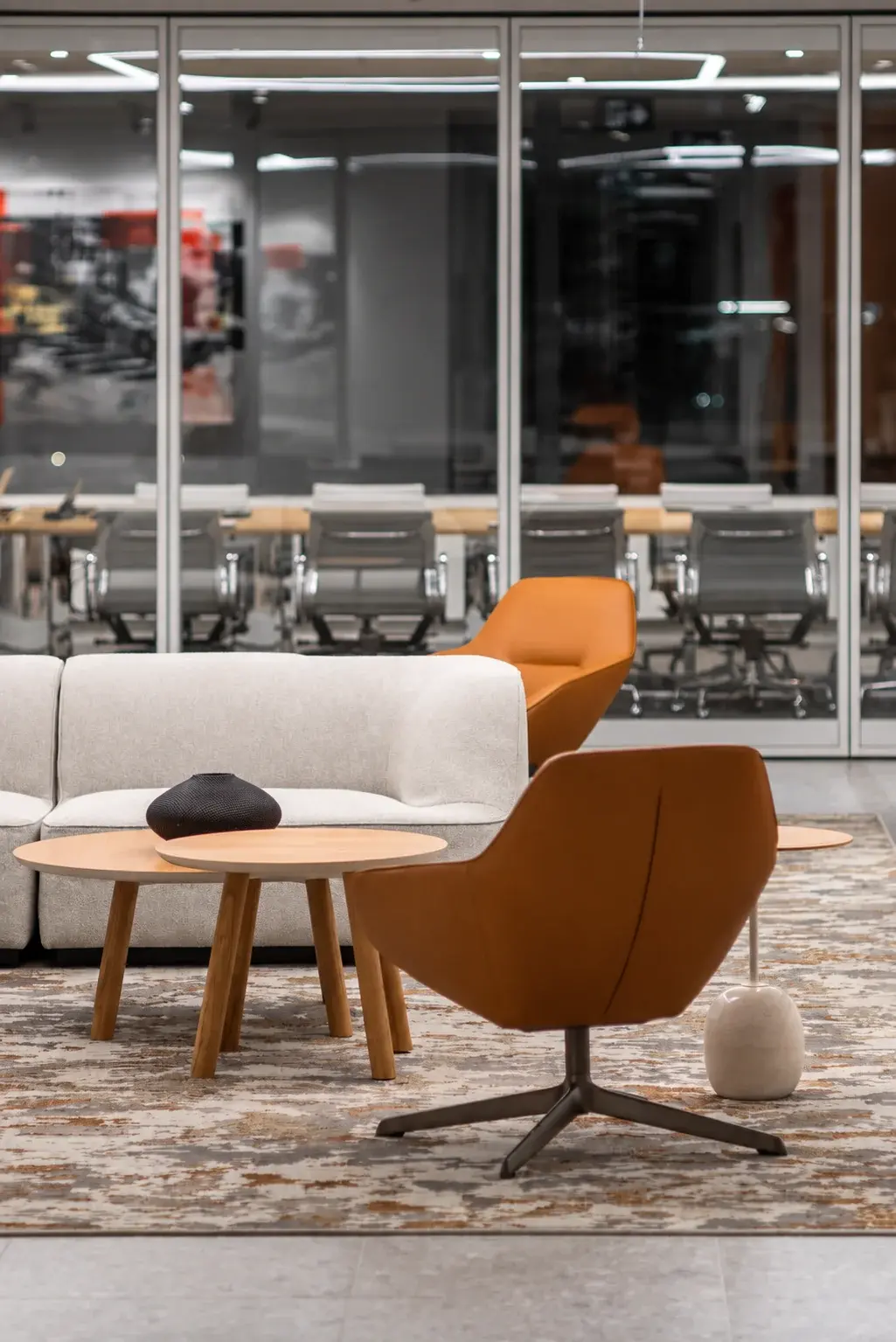 Lounge seating beside a glazed meeting room in Osler's workplace