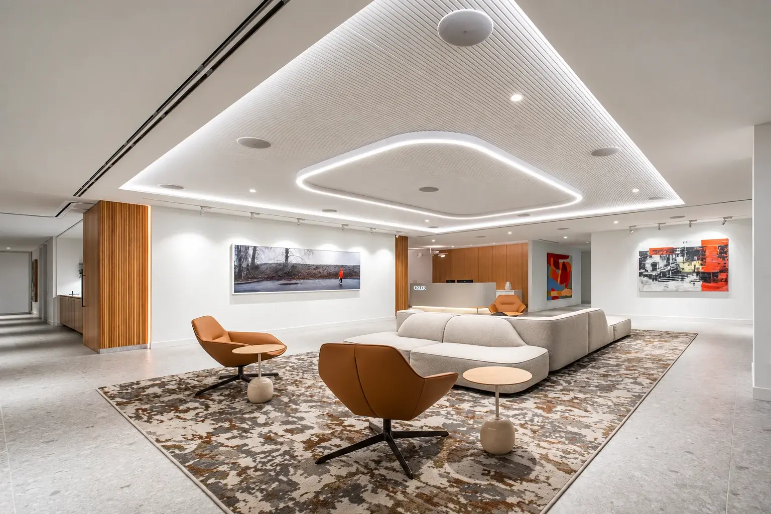 Osler reception lounge with varied seating and illuminated ceiling details