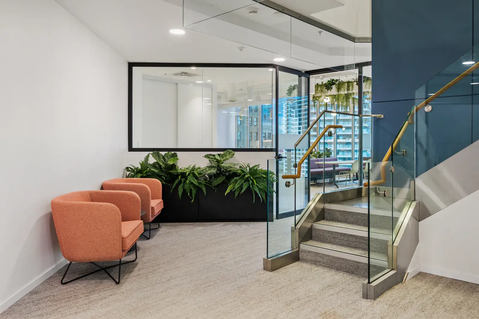 Informal lounge seating beside the workplace stair
